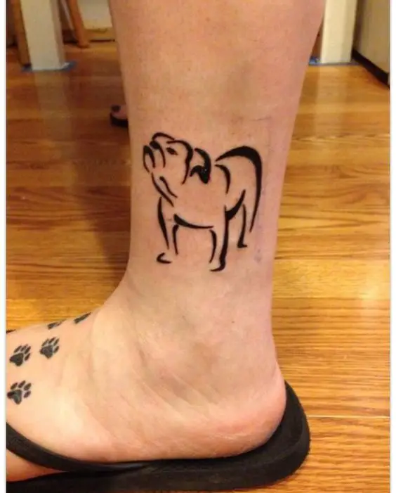 outline of a looking up while standing English Bulldog tattoo on the ankle