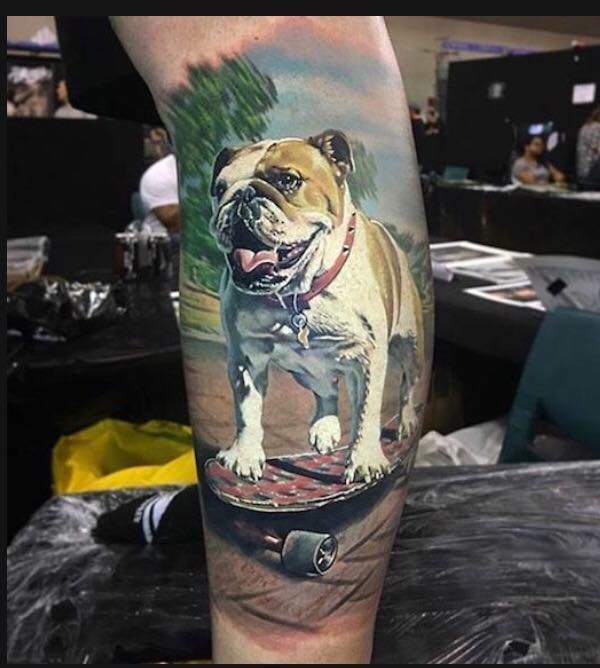 realistic skateboarding English Bulldog in the street tattoo