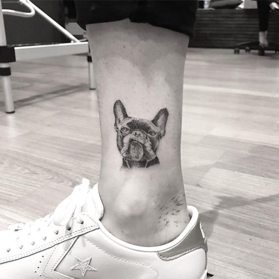 smirking face of French Bulldog Tattoo on the ankle