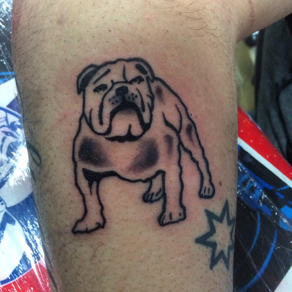 outline of English Bulldog tattoo on the arm