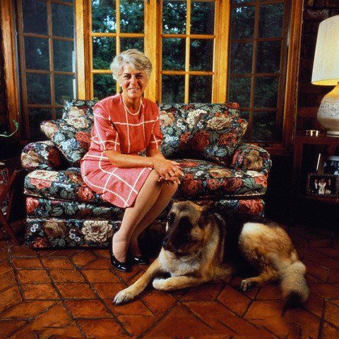 Geraldine Ferarro on the couch and its German Shepherd lying down on the floor