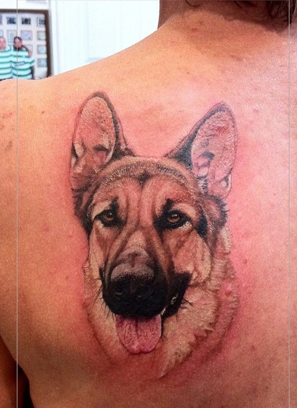 face of a German Shepherd Dog with its tongue sticking out Tattoo on the back