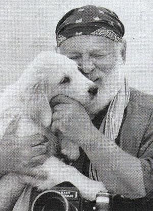Bruce Weber hugging his Golden Retriever puppy