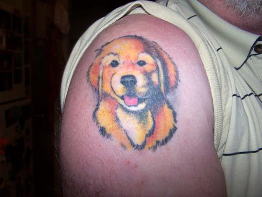 animated Golden Retriever puppy Tattoo on the shoulder
