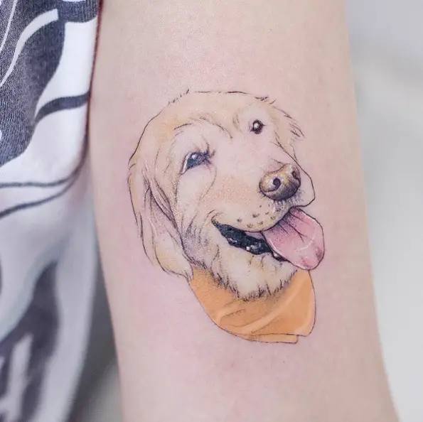 minimalist drawing of smiling face of Golden Retriever tattoo on the biceps