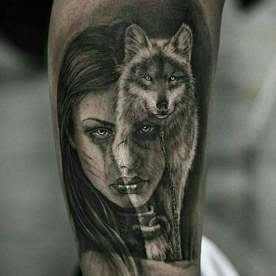 face of a woman with a walking Husky tattoo on the leg