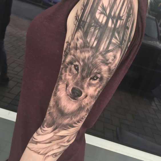 3D tattoo on the shoulder of a Husky with trees behind him 