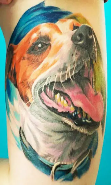 happy face of a Jack Russell Terrier Tattoo on the thigh