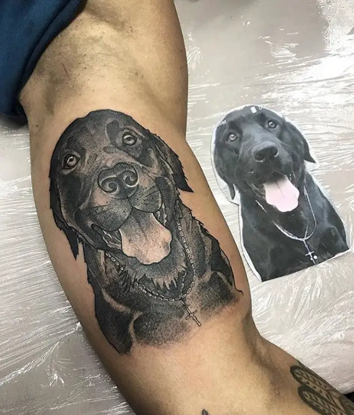 black Labrador Retriever Dog sticking its tongue out tattoo on the biceps