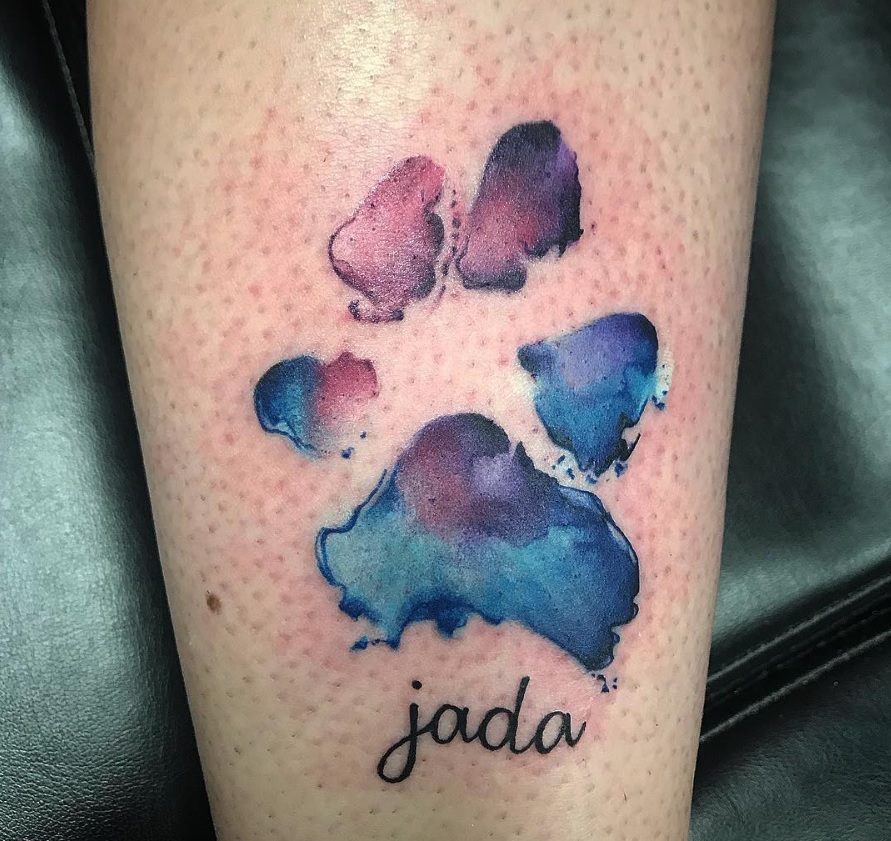 watercolor paw print tattoo on wrist