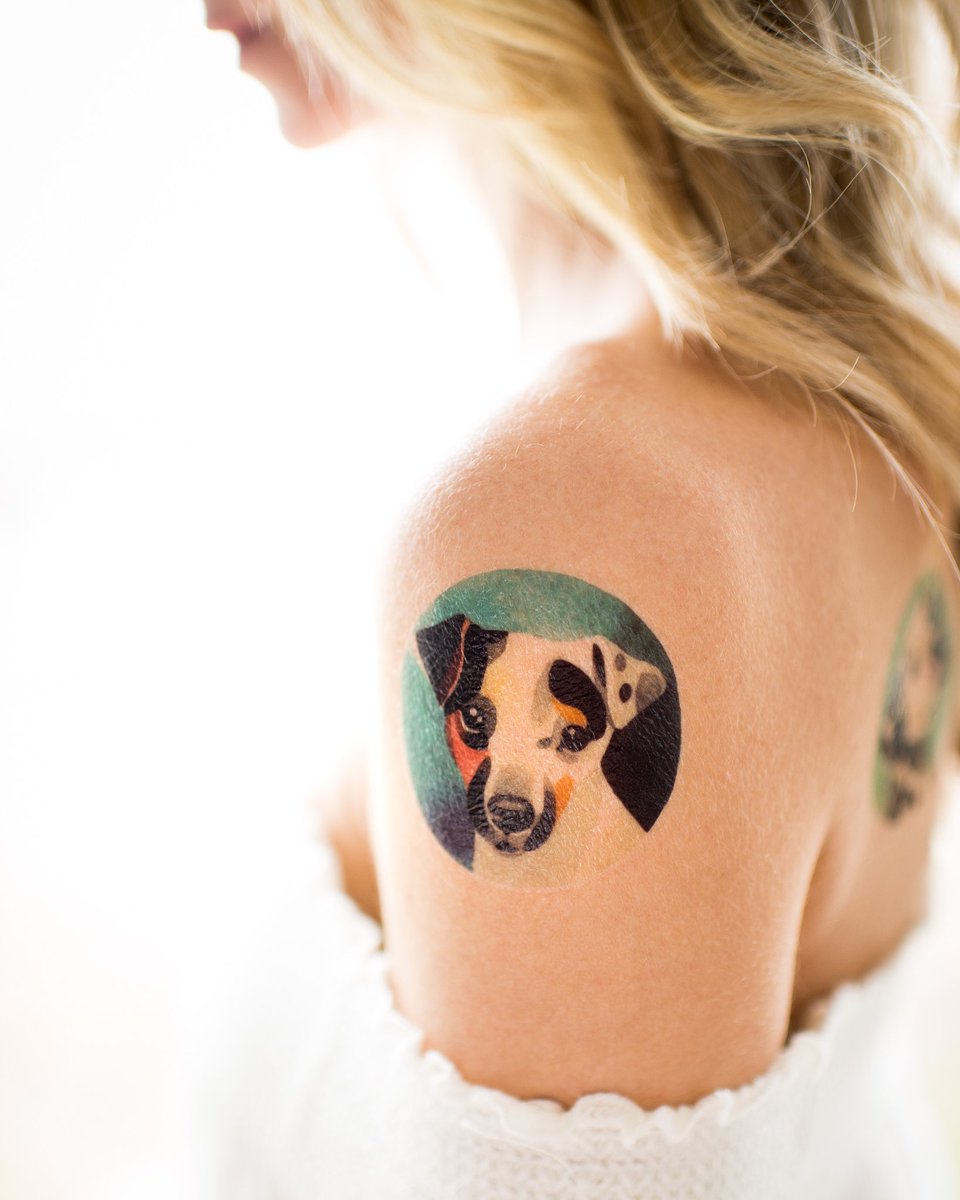Jack Russell Terrier in an ombre green and black circle Tattoo on the shoulder