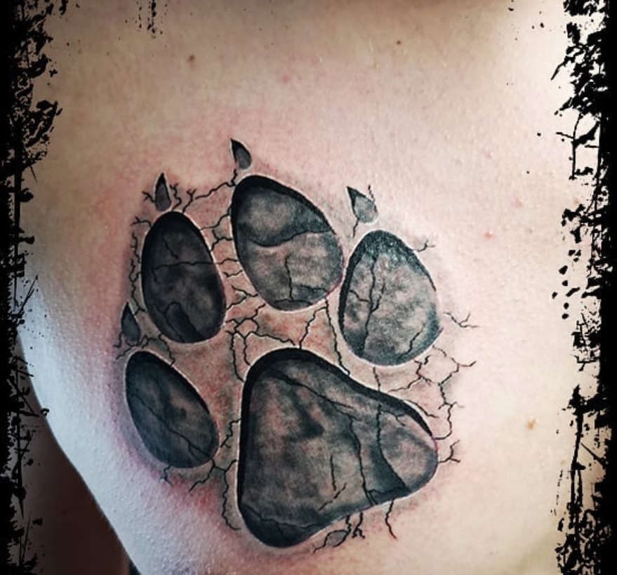 paw print with crack tattoo