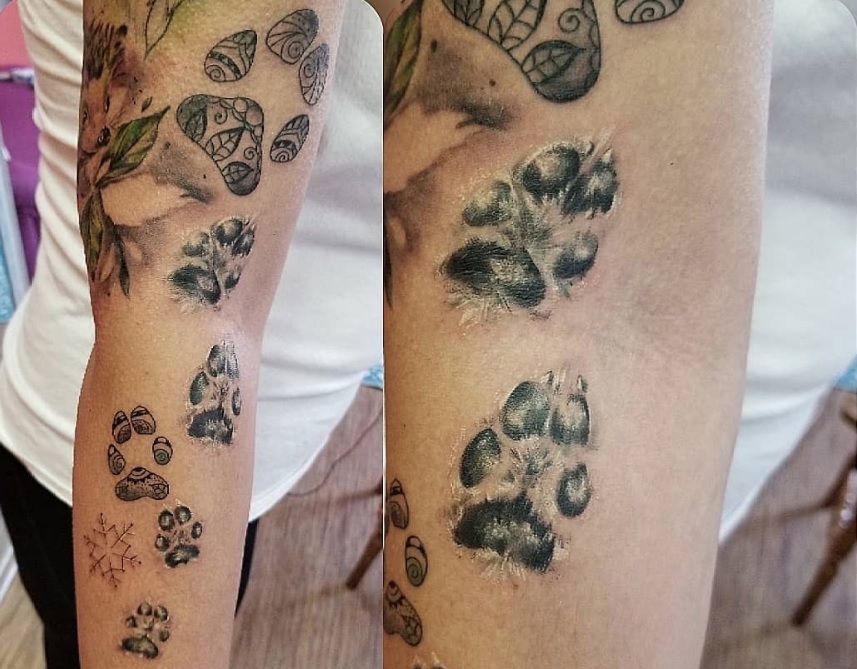 paw print tattoo on wrist