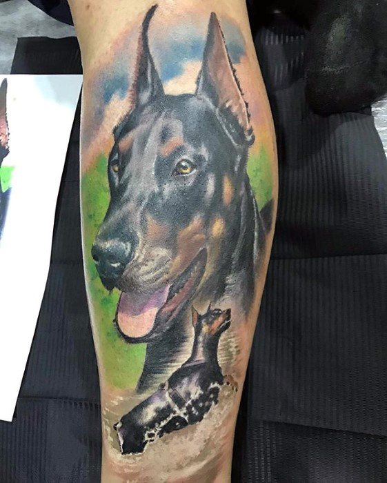 realistic large sideview head of a Doberman and him in the water tattoo on the leg