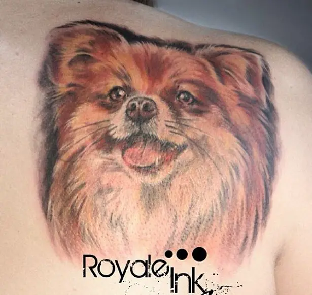 3D red happy face of a Pomeranian Tattoo on the back