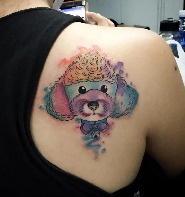 colorful face f a Poodle puppy tattoo on the back
