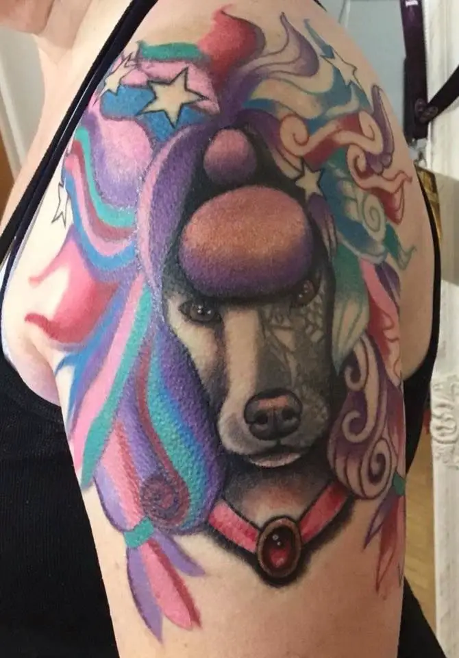 A Poodle Dog Tattoo with colorful and artistic hair tattoo on the shoulder