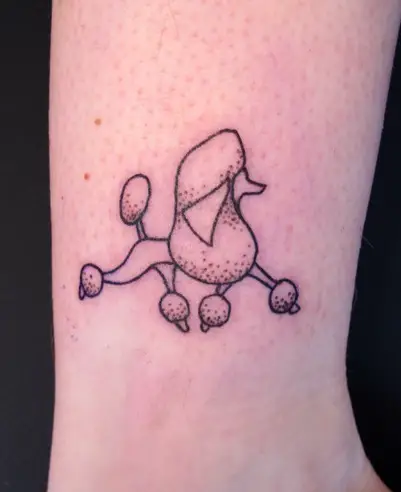 An outline of a walking Poodle Dog Tattoo tattoo on the ankle