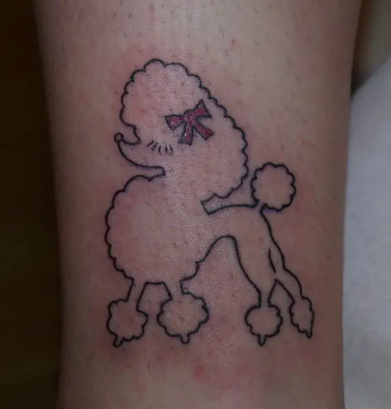 An outline of a Poodle with pink ribbon tattoo on the leg