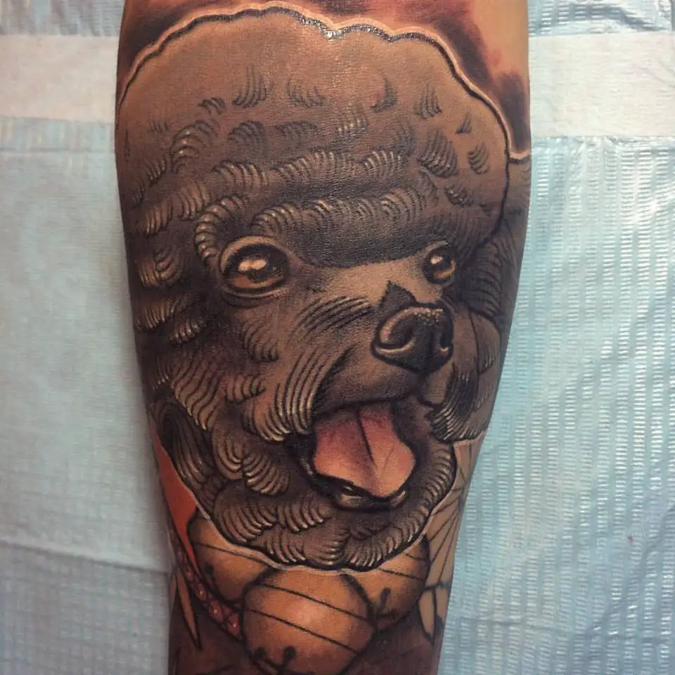 A 3D face of a black Poodle tattoo on the leg