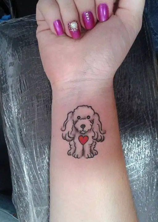 An outline of a white poodle with red heart on its chest tattoo on the forearm