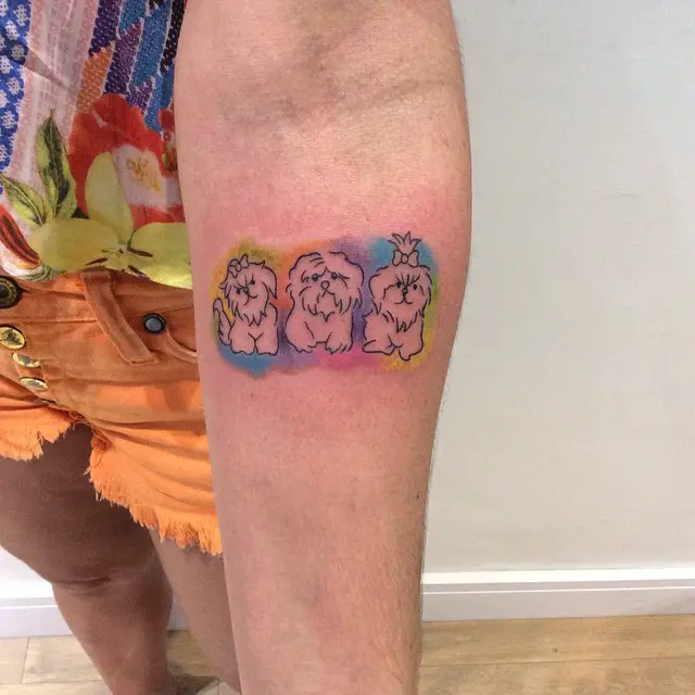 outline of three Shih Tzus in colorful pastel background Tattoo on forearm