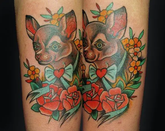 Chihuahua with flowers couple tattoo on the forearm