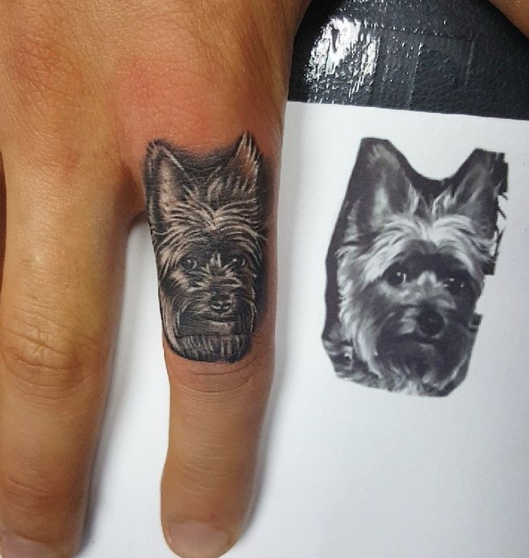 black Yorkshire Terrier tattoo on the ring finger