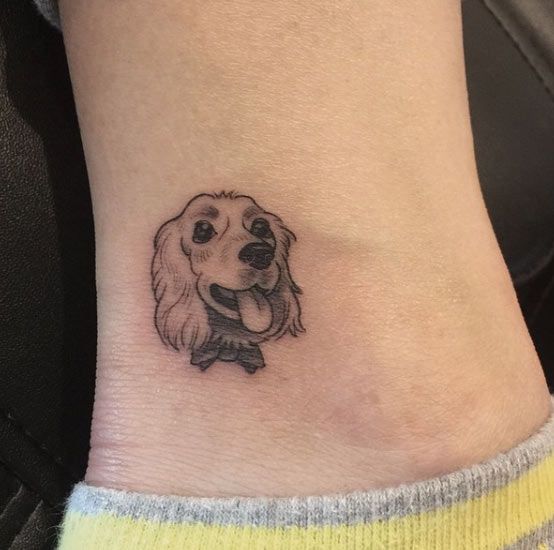 animated face of Cocker Spaniel with its tongue sticking out Tattoo on the ankle