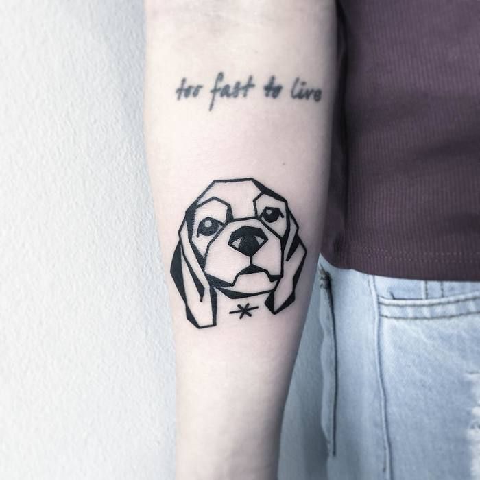 face of Cocker Spaniel in geometric design Tattoo on the forearm