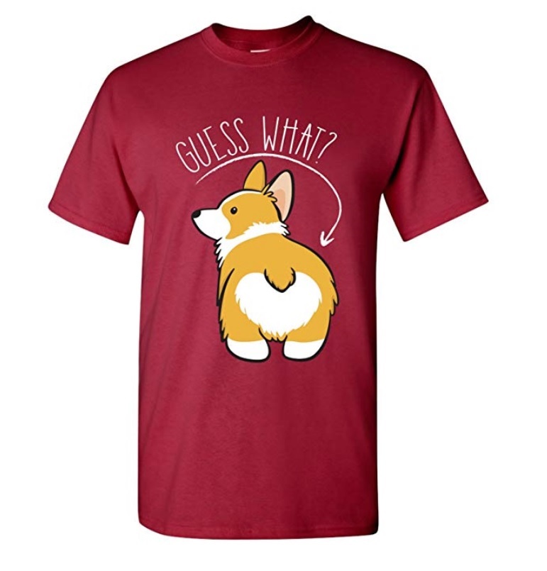 A red shirt printed with a Corgi face back and with text - Guess what and an arrow pointed to the butt