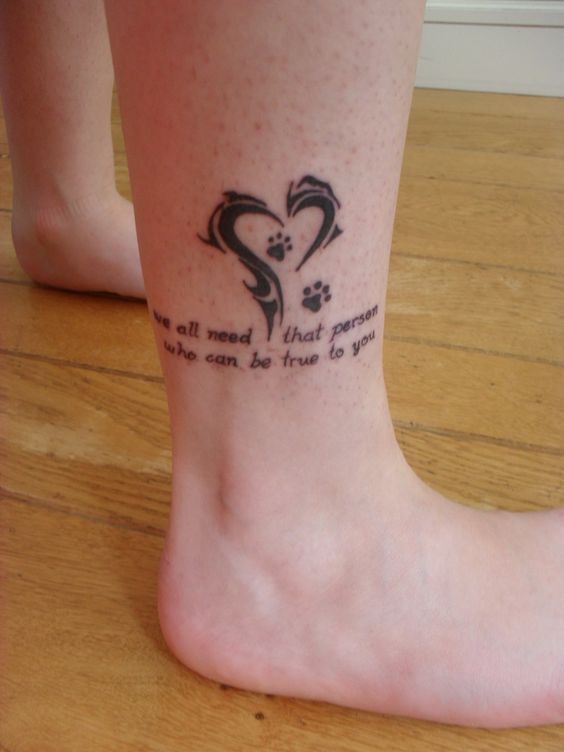 tribal heart shape with paw print and a saying 