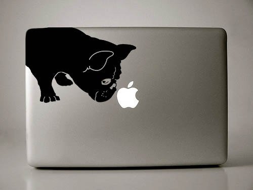 A French Bulldog sticker on the laptop cover