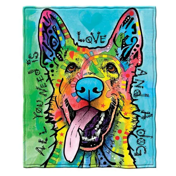 A fleece pillow blanket with a colorful portrait of a german shepherd's face