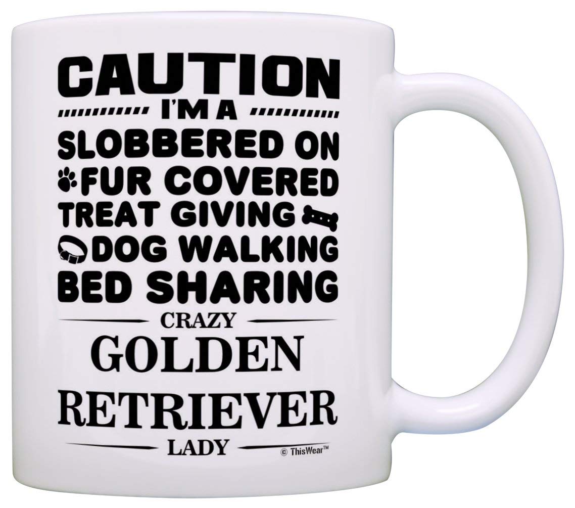 A white mug printed with - Caution I am slobbered on, fur covered, treat giving, dog walking, bed sharing, crazy golden retriever lady