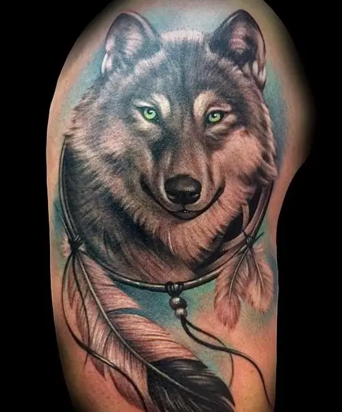 Head of a Husky in a circle frame with feathers with blue shadow background 3D tattoo on the shoulder