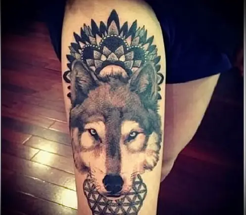 face of a Husky with mandala design on top of it head tattoo on the thigh