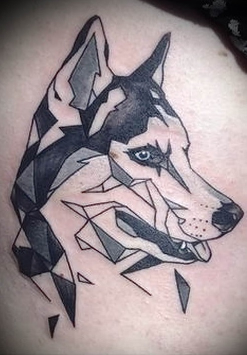black and grey sideview head of a Husky designed with triangle shapes tattoo on men