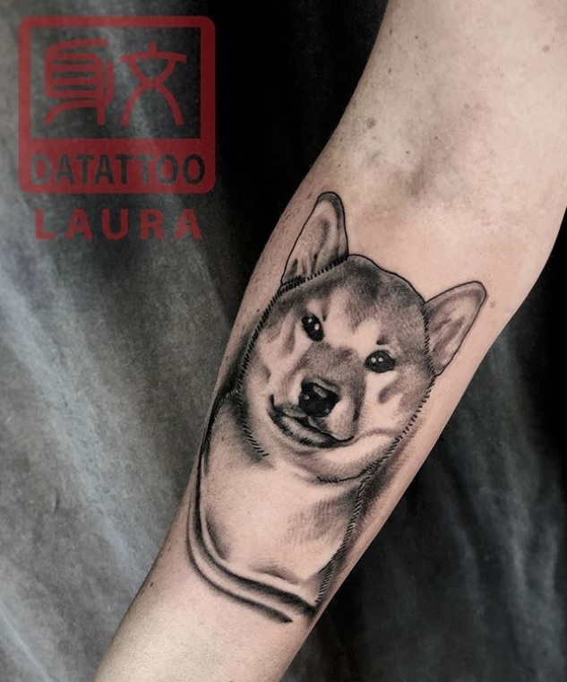 3D face of a Shiba Inu tattoo on the forearm