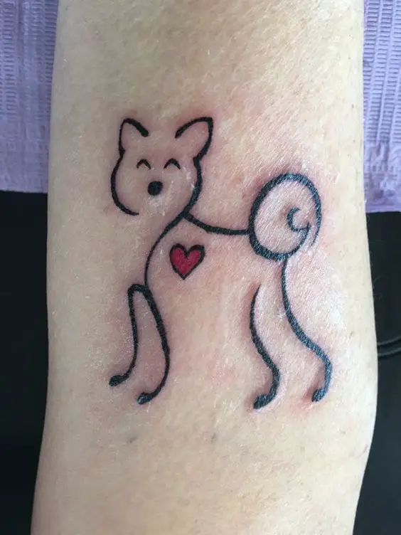 Shiba Inu in outline style tattoo on the forearm