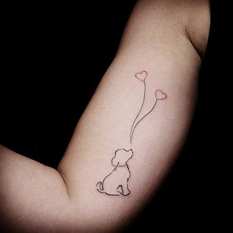 outline of sitting dog with balloon hearts tattoo on the biceps