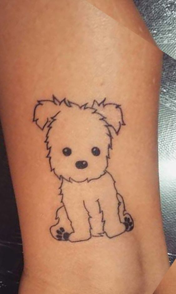 sitting puppy tattoo on ankle