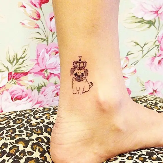 pug wearing crown tattoo on the ankle