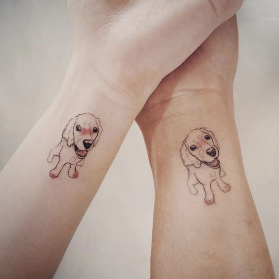 couple outline of dog tattoo on the wrist