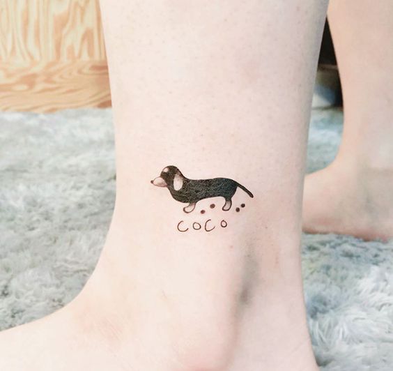 small dachshund dog tattoo on the ankle