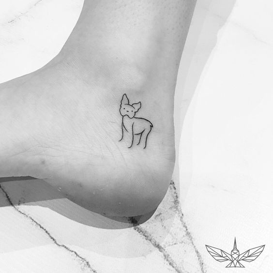 outline dog tattoo on the ankle