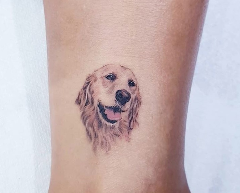 face of a golden retriever tattoo on the ankle