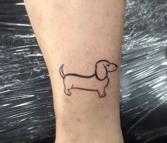outline of dachshund dog tattoo on the ankle