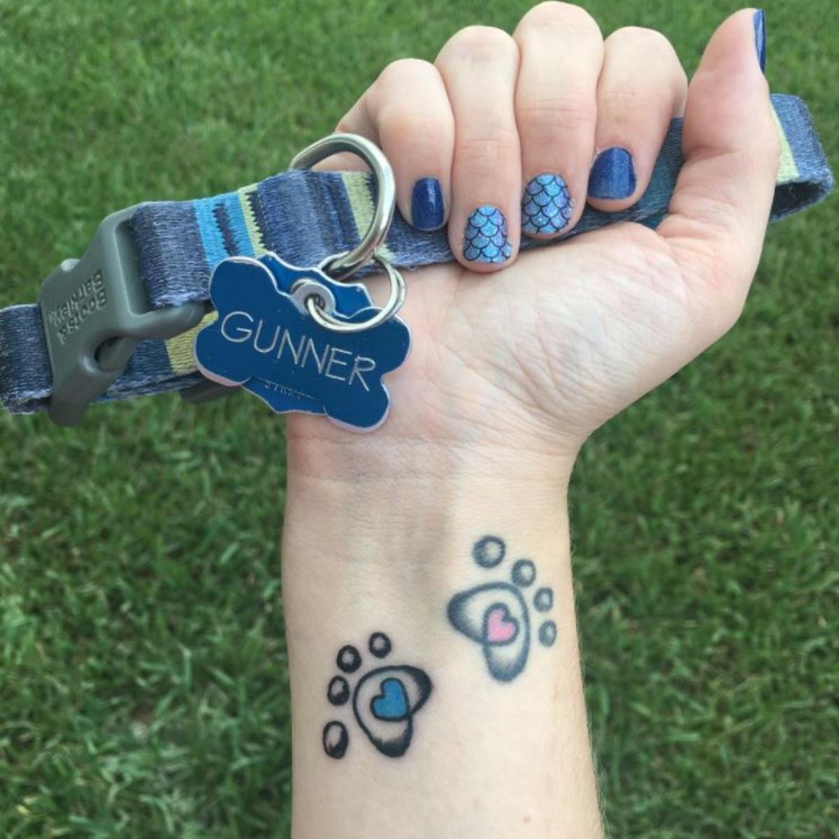 lined colorful paw print tattoo on wrist