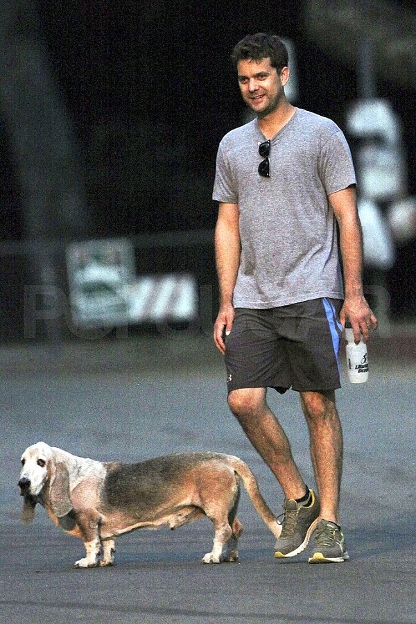 Joshua Jackson taking a walk with its Basset Hound dog